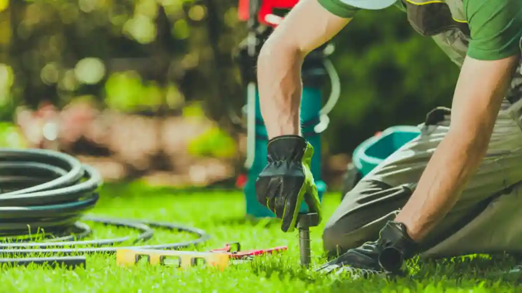 Benefits of Sprinkler Irrigation Over-Drip Irrigation System Sprinkler installation on ground by man